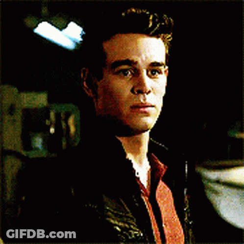 A Close Up Of A Man 'S Face With A Black Jacket On GIF