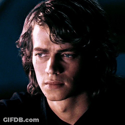 A Close Up Of A Man 'S Face With A Black Shirt GIF