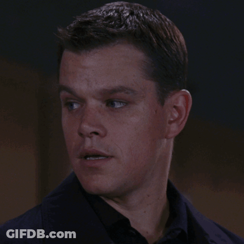 A Close Up Of A Man 'S Face With A Black Shirt GIF