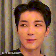 A Close Up Of A Man 'S Face With A Black Shirt On . GIF