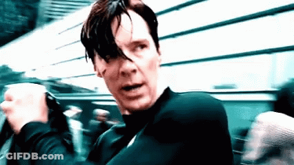 A Close Up Of A Man 'S Face With A Black Shirt On GIF