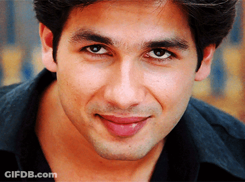 A Close Up Of A Man 'S Face With A Black Shirt GIF