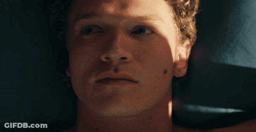 A Close Up Of A Man 'S Face With A Black Spot On His Face GIF