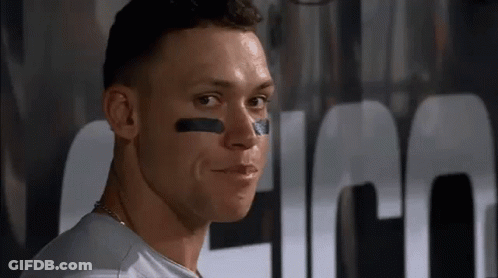 A Close Up Of A Man 'S Face With A Black Stripe On His Face . GIF
