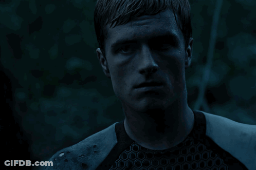 A Close Up Of A Man 'S Face With A Blue Background GIF