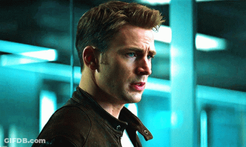 A Close Up Of A Man 'S Face With A Blue Background GIF