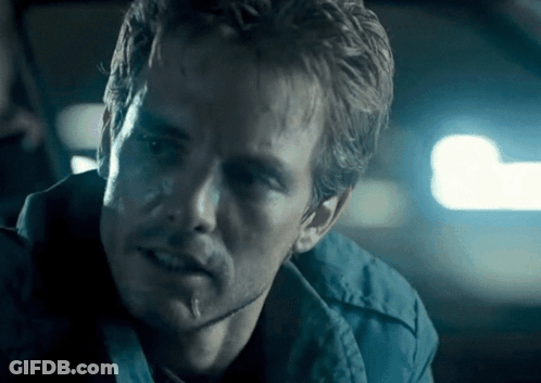 A Close Up Of A Man 'S Face With A Blue Background GIF
