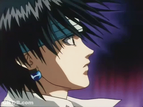 A Close Up Of A Man 'S Face With A Blue Earring GIF