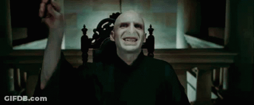 A Close Up Of A Man 'S Face With A Blue Light Coming Out Of His Eyes GIF