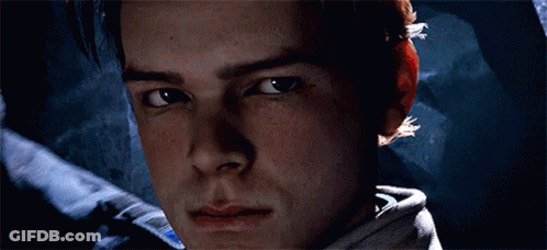 A Close Up Of A Man 'S Face With A Blue Light Coming Out Of It GIF