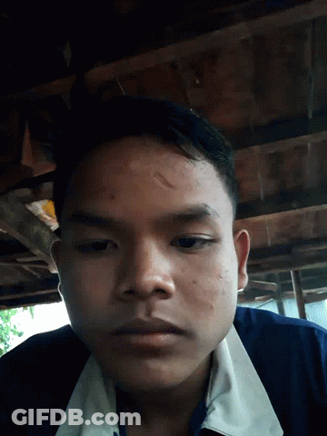 Close Up Of Man's Face In Blue Shirt GIF