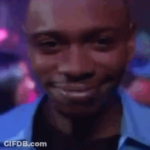 A Close Up Of A Man 'S Face With A Blue Shirt On GIF