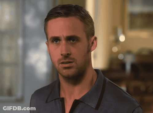 A Close Up Of A Man 'S Face With A Blue Shirt On GIF