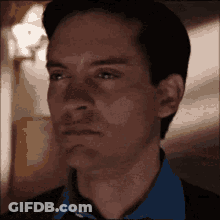 A Close Up Of A Man 'S Face With A Blurred Background GIF