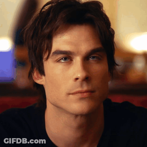 A Close Up Of A Man 'S Face With A Blurred Background GIF