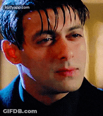 A Close Up Of A Man 'S Face With A Blurred Background . GIF