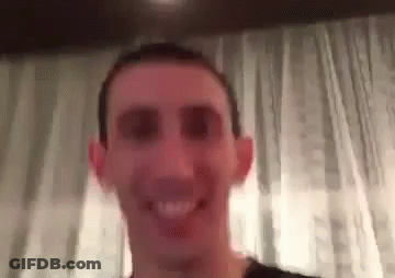 A Close Up Of A Man 'S Face With A Blurred Background . GIF