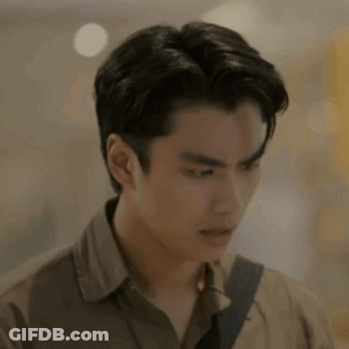A Close Up Of A Man 'S Face With A Blurred Background And A Shoulder Strap . GIF
