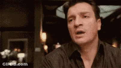 A Close Up Of A Man 'S Face With A Blurred Background . GIF