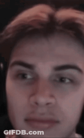 A Close Up Of A Man 'S Face With A Blurred Background GIF