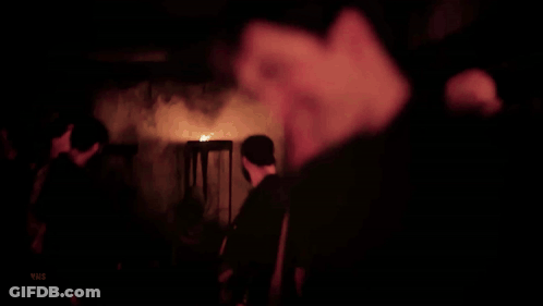 A Close Up Of A Man 'S Face With A Blurred Background GIF