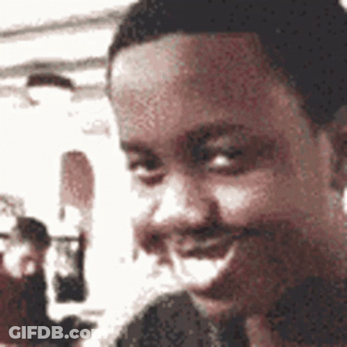 A Close Up Of A Man 'S Face With A Blurred Background GIF