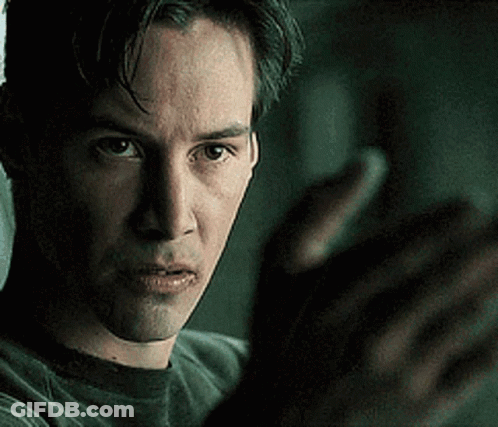 A Close Up Of A Man 'S Face With A Blurred Background GIF