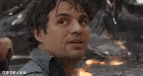A Close Up Of A Man 'S Face With A Blurred Background Looking At The Camera . GIF