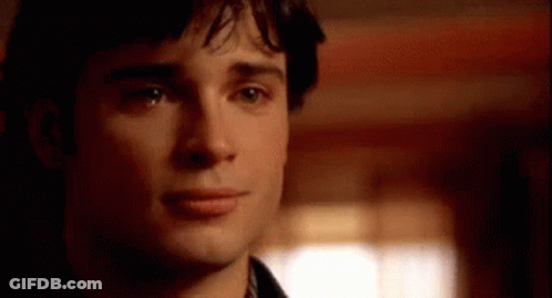 A Close Up Of A Man 'S Face With A Blurred Background Looking At The Camera . GIF