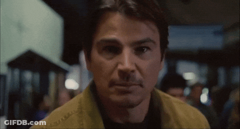 A Close Up Of A Man 'S Face With A Blurred Background GIF