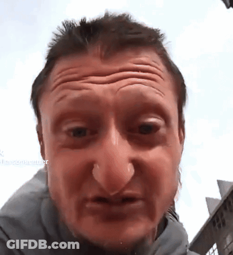 A Close Up Of A Man 'S Face With A Blurred Background That Says ' Larsonrecorder ' On It GIF