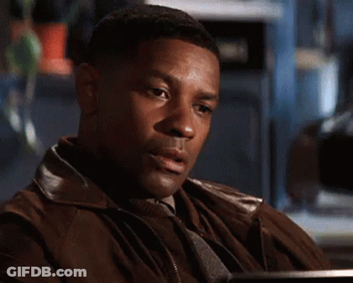 A Close Up Of A Man 'S Face With A Blurred Background GIF