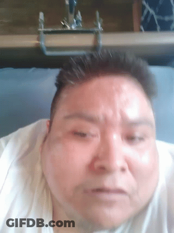 A Close Up Of A Man 'S Face With A Blurred Background GIF