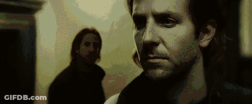 A Close Up Of A Man 'S Face With A Blurred Background GIF