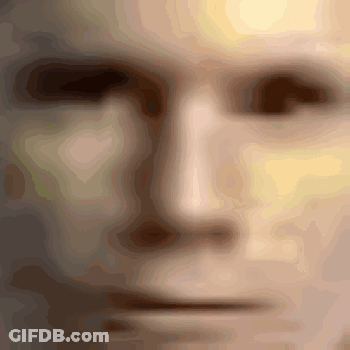 A Close Up Of A Man 'S Face With A Blurred Image GIF