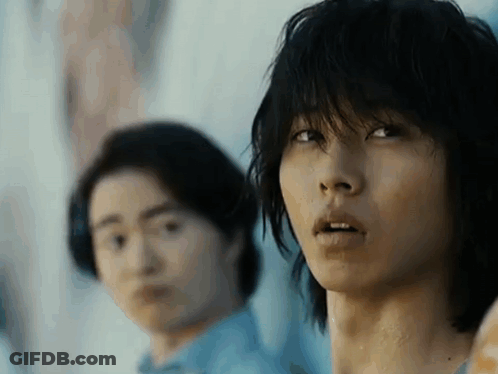 A Close Up Of A Man 'S Face With A Blurry Background . GIF