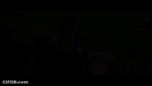 A Close Up Of A Man 'S Face With A Blurry Background Behind Him GIF