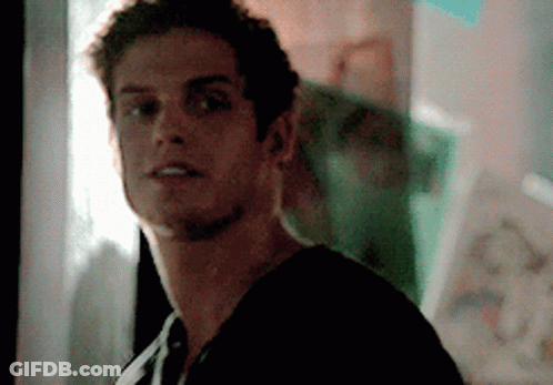 A Close Up Of A Man 'S Face With A Blurry Background GIF