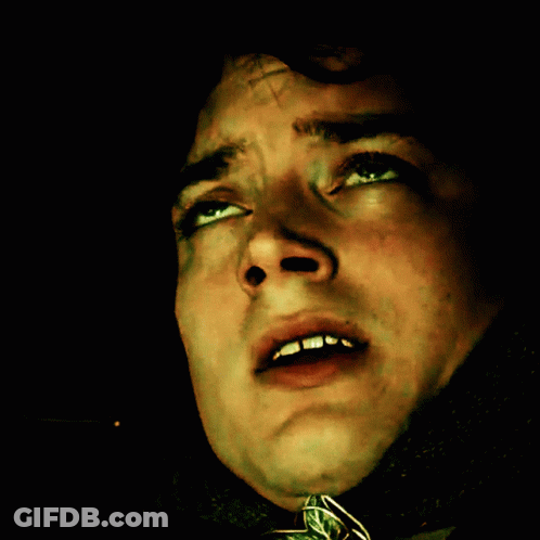 A Close Up Of A Man 'S Face With A Cross On It GIF