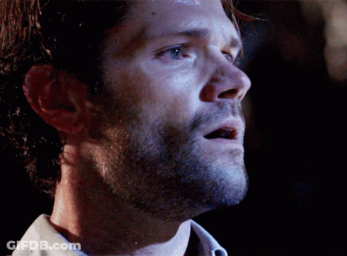 A Close Up Of A Man 'S Face With A Dark Background GIF