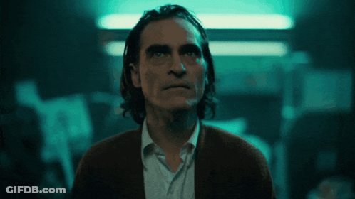 Close Up Of Man's Face With Dark Background GIF