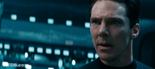 A Close Up Of A Man 'S Face With A Dark Background GIF