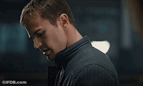 A Close Up Of A Man 'S Face With A Dark Background GIF