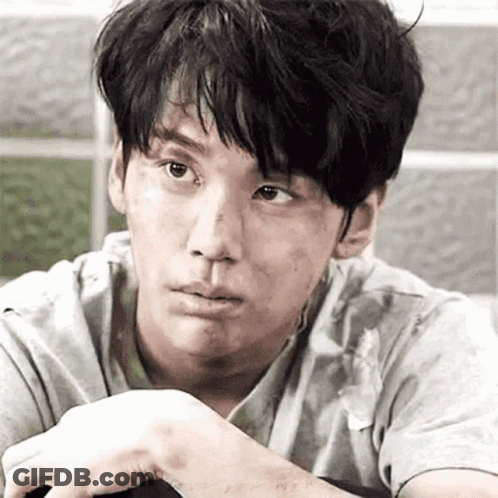 A Close Up Of A Man 'S Face With A Dirty Face And A Dirty Shirt . GIF