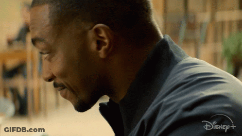 A Close Up Of A Man 'S Face With A Disney + Logo Visible GIF