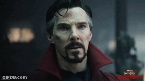 A Close Up Of A Man 'S Face With A Doctor Strange Logo In The Background GIF