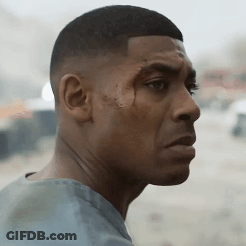 A Close Up Of A Man 'S Face With A Few Spots Of Blood On It GIF