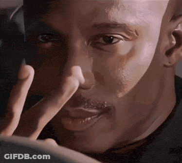 A Close Up Of A Man 'S Face With A Finger In His Nose GIF