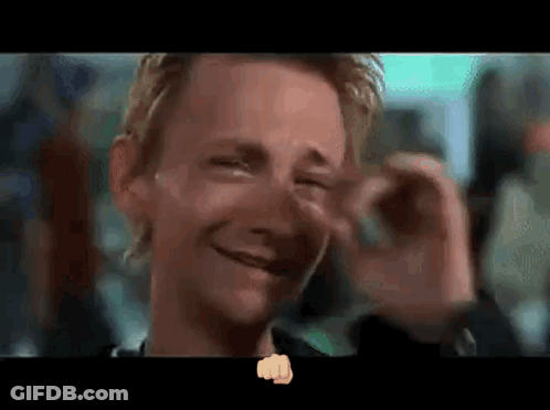 A Close Up Of A Man 'S Face With A Fist In The Foreground GIF