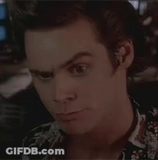 A Close Up Of A Man 'S Face With A Floral Shirt On . GIF